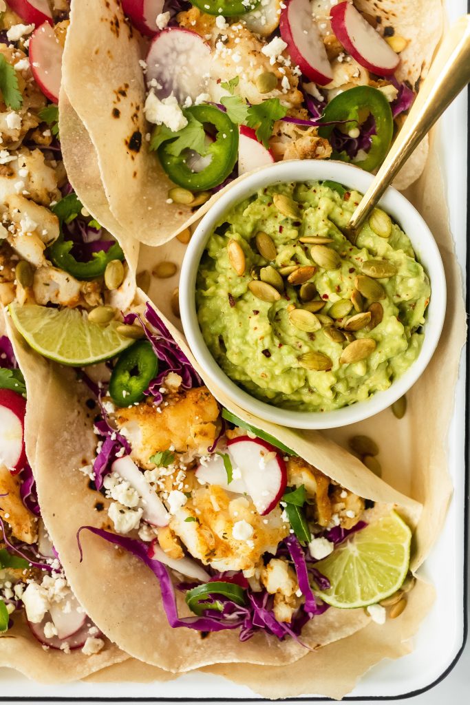 blackened cod fish tacos with cabbage slaw, jalapeno, radish, lime and avocado