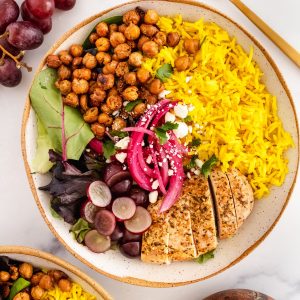 coconut turmeric rice power bowl with greens and garlic roasted chickpeas