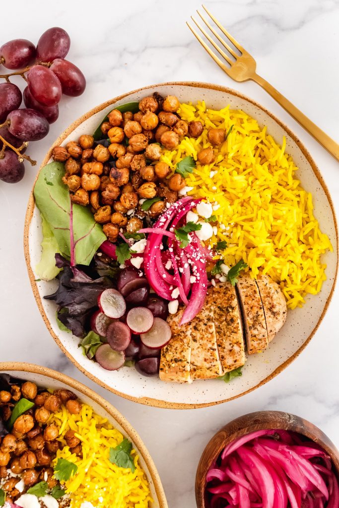 coconut turmeric rice power bowl with greens and garlic roasted chickpeas