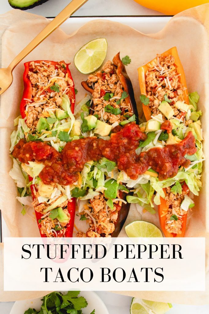 flavorful and fun chicken taco stuffed pepper boats with cheese, shredded lettuce, avocado and salsa