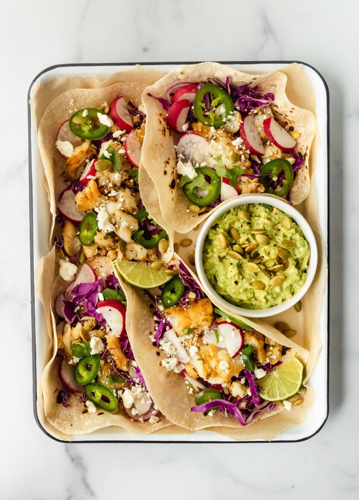gluten free blackened fish tacos with veggies and avocado
