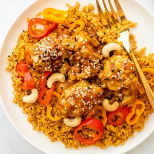 healthy baked orange chicken with peppers and rice