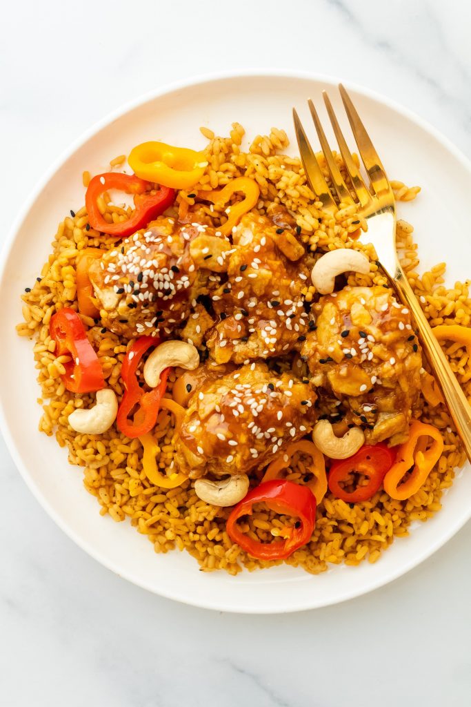healthy baked orange chicken with peppers and rice