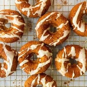 healthy baked pumpkin donuts with pumpkin spice maple glaze