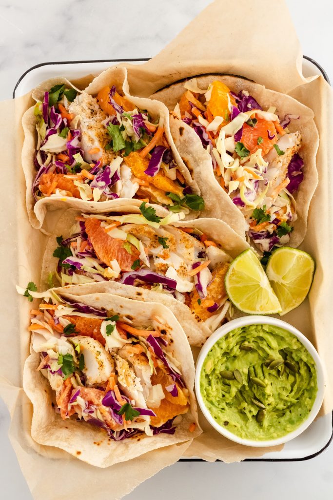 healthy cod fish tacos with dairy free citrus tahini coleslaw