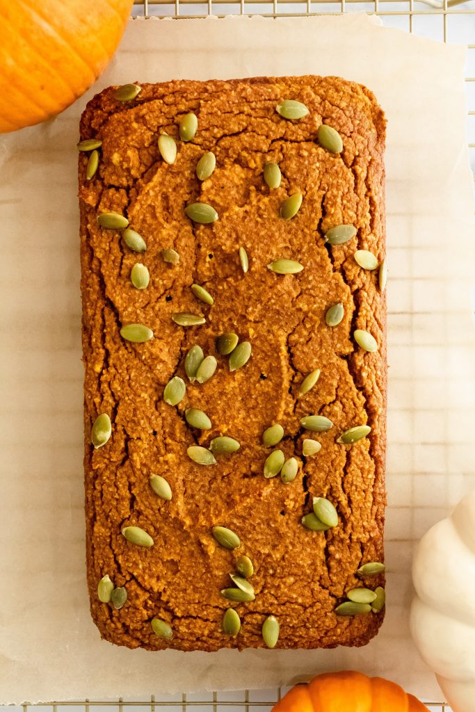paleo pumpkin bread with pumpkin seeds on top