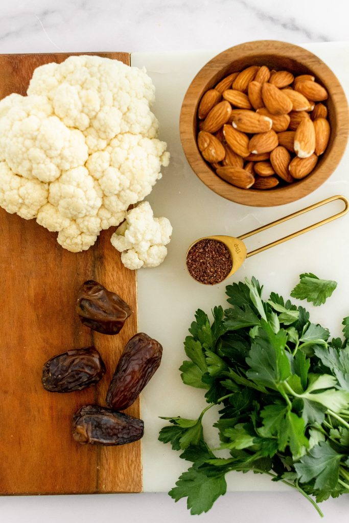 riced cauliflower salad with dates, nuts and fresh herbs