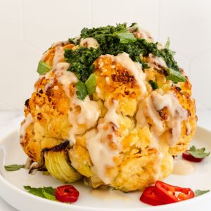 whole-roasted-cauliflower-with-tahini-and-spicy-herb-sauce