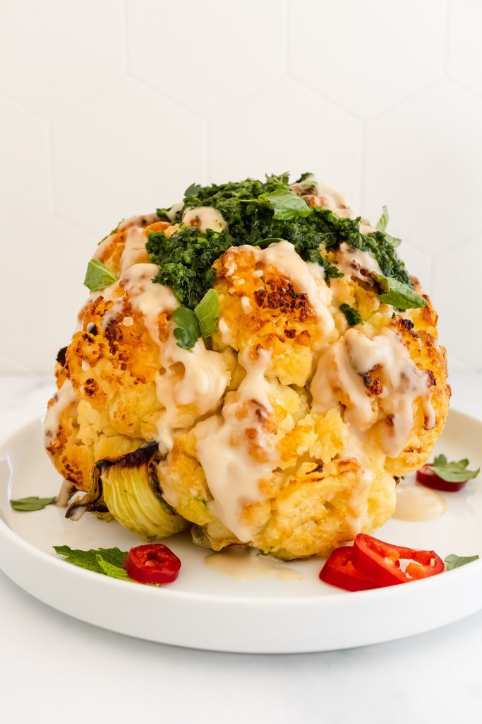 Whole Roasted Cauliflower with Tahini and Spicy Herb Sauce 