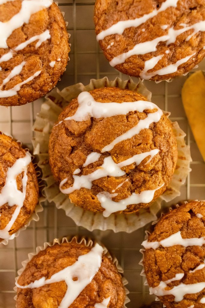 whole wheat pumpkin muffins with white chocolate drizzle